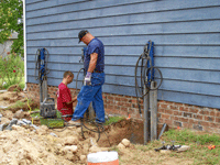 installing piers to repair a foundation